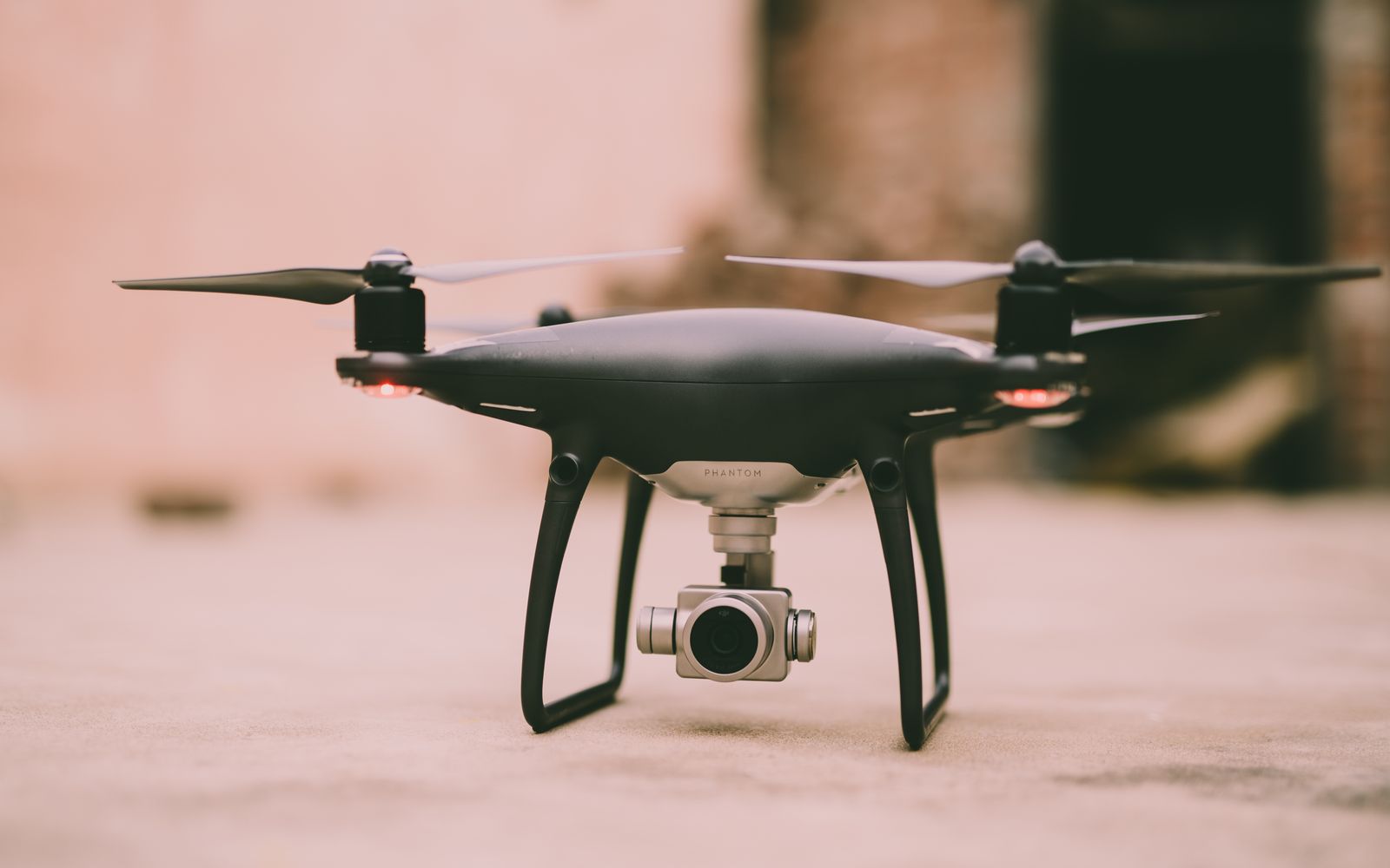 A detailed view of a Phantom drone with camera ready for flight outdoors.