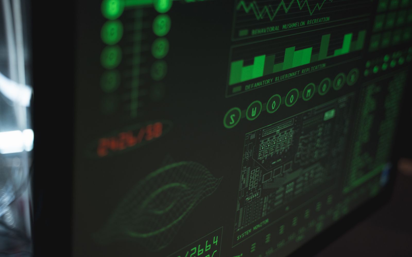 Close-up view of a computer displaying cybersecurity and data protection interfaces in green tones.